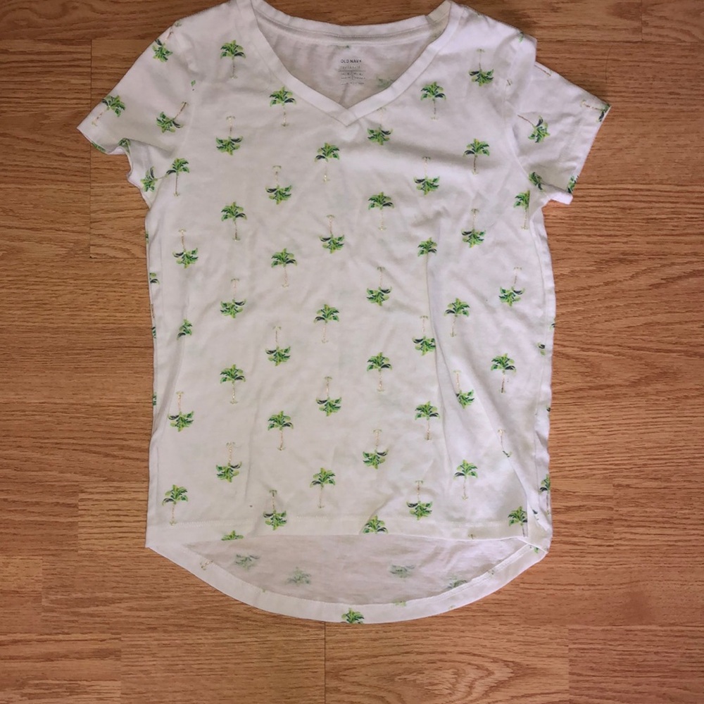 White v-neck shirt with palm trees all over.